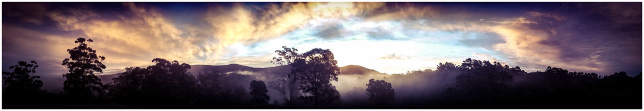 Scenic view of mountains against cloudy sky