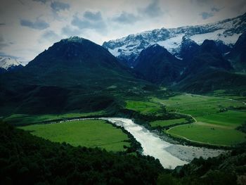 Scenic view of snowcapped mountains against sky