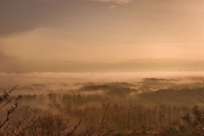 Scenic view of landscape against sky during sunset