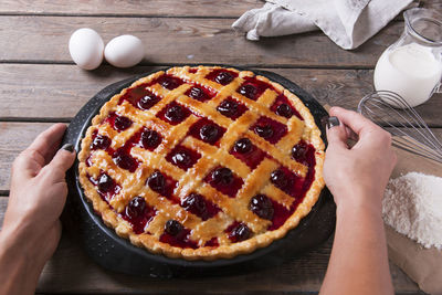 Midsection of woman holding a pie