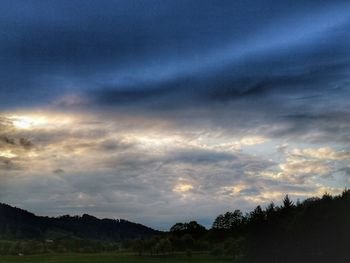 Scenic view of dramatic sky over landscape