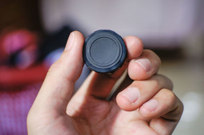 Close-up of hand holding camera