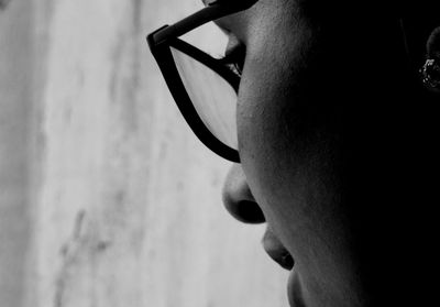 Close-up of woman wearing eyeglasses