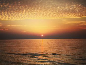 Scenic view of sea against dramatic sky