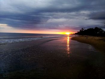 Scenic view of sea against cloudy sky