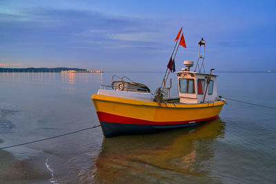 Boat in sea against sky