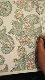 Cropped image of human hand on wall