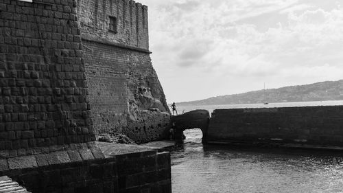 Fortess near sea against sky