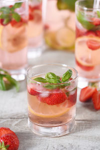 Summer strawberry cocktail or lemonade with basil. cold organic soft drink with  berries in a glass