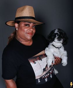 Portrait of teenage girl holding dog