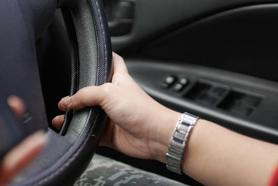 Close-up of hand holding car