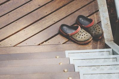 High angle view of shoes on wooden table