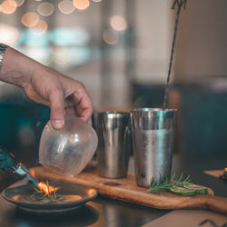 Midsection of person preparing food on table