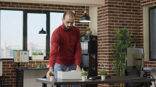 Side view of man working in office