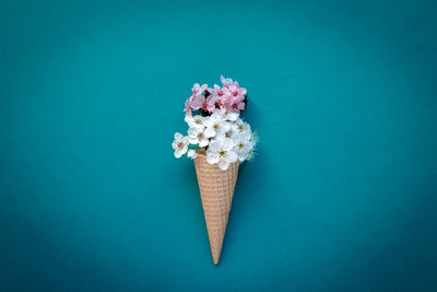 Directly above shot of ice cream against blue background