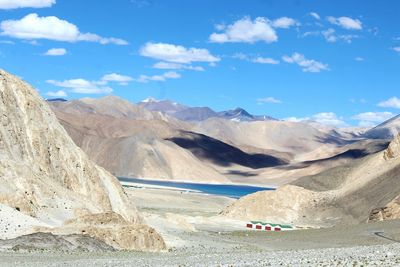 Scenic view of lake and mountains against sky at ladakh region