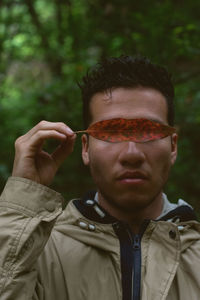 Portrait of young man wearing sunglasses