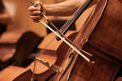 Cropped image of man playing guitar