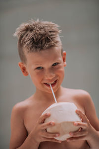 Portrait of boy holding ice cream