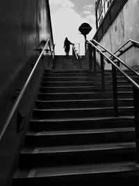 Low angle view of people walking on stairs