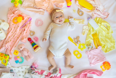 High angle view of cute girl playing with toys