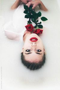 Portrait of woman with red roses