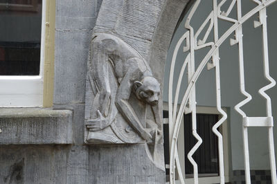 Low angle view of statue against building