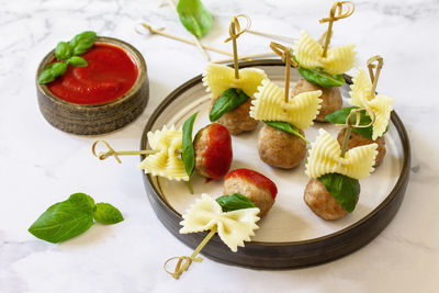 High angle view of fruits in plate on table