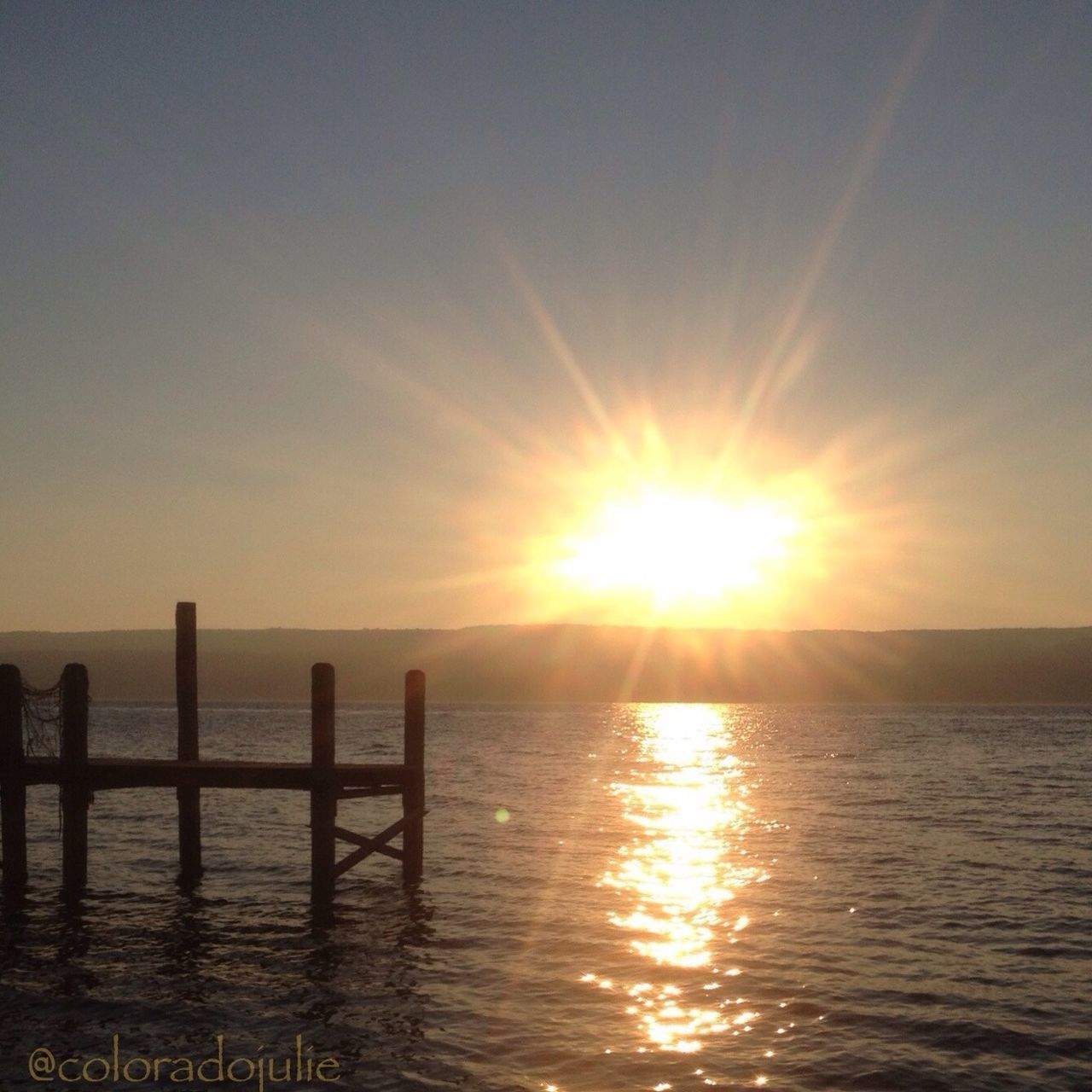 sun, water, sunset, sea, tranquil scene, scenics, tranquility, beauty in nature, sunlight, sky, reflection, waterfront, nature, sunbeam, idyllic, pier, horizon over water, rippled, lens flare, outdoors