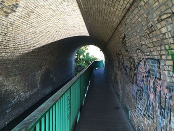 Narrow walkway in tunnel