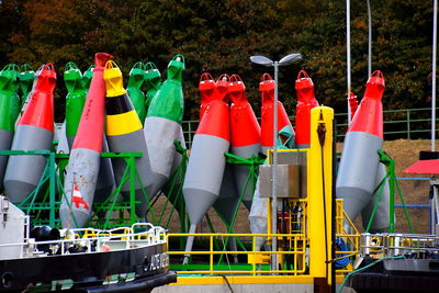 Close-up of multi colored umbrellas on field