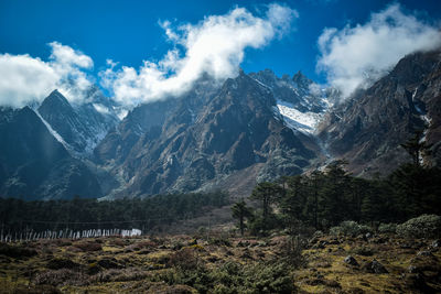 Scenic view of snowcapped mountains against sky
