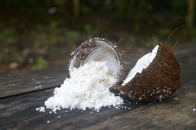 Grated coconut in wooden table