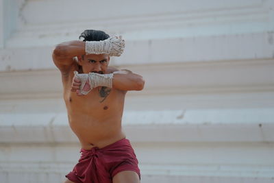 Shirtless man at temple