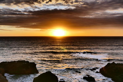 Scenic view of sea against sky during sunset