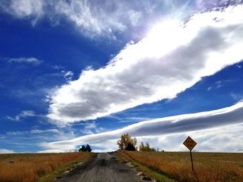 Road amidst landscape against sky