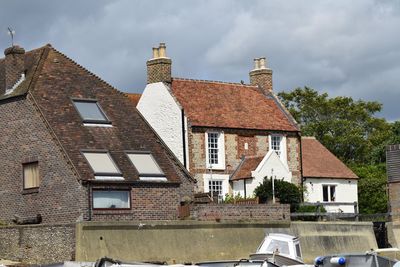 Houses against sky in city