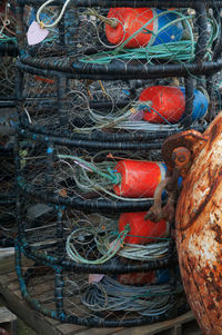 Bouy on rack seen through fishing net
