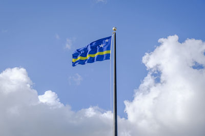 Low angle view of flag against sky