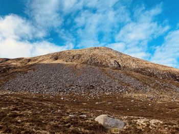 Low angle view of rocks against sky