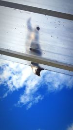 Low angle view of airplane flying in sky