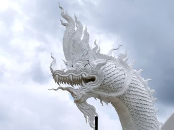 Low angle view of horse statue against sky