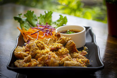 Close-up of food served on table