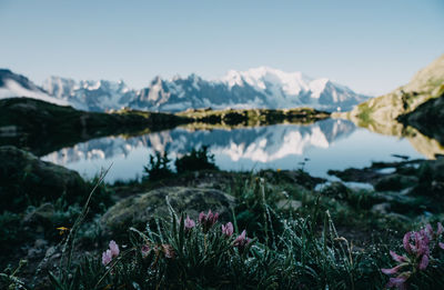 Scenic view of lake and mountains against sky
