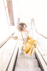 High angle view of woman standing on floor