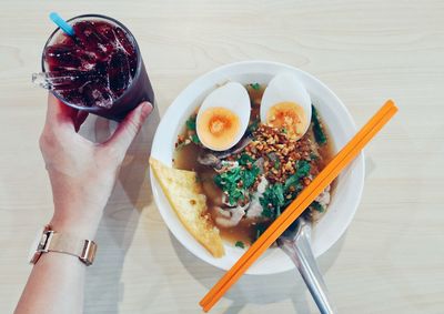 Close-up of person having food