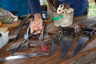 Cropped hand of man working at workshop