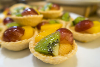 Close-up of fruit tarts on table