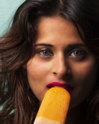 Close-up portrait of woman eating food