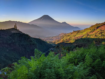 Scenic view of mountains against sky during sunset